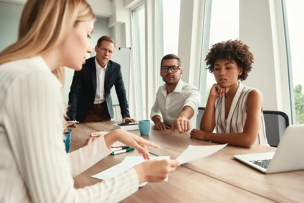 Business leaders collaborating around a meeting table